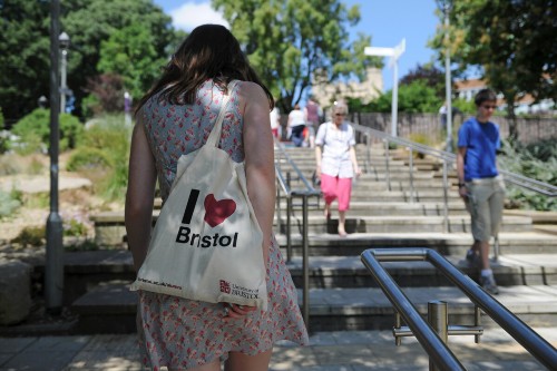 Student with bag reading I Love Bristol